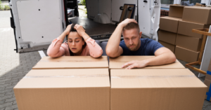 Couple stressed out with moving boxes